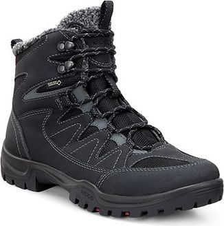 Black high top hiking boot with laces and faux fur trim.