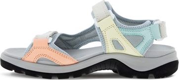 A sandal with pale peach, yellow and aqua color blocks.