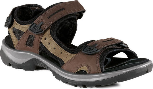 Brown leather sandal with velcro straps and thick sole.