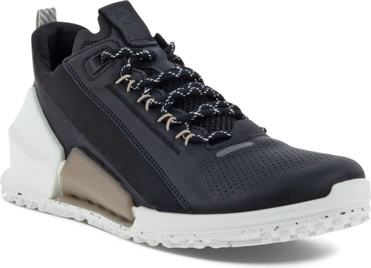 Black athletic shoe with a white midsole and patterned laces.