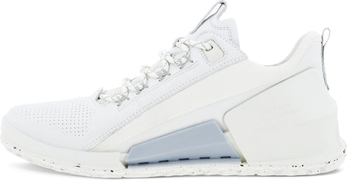 A white athletic shoe with a textured sole and white laces.