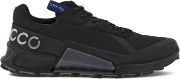 A black athletic shoe with a "GORE-TEX" label on the tongue and "CCO" in large letters near the heel.