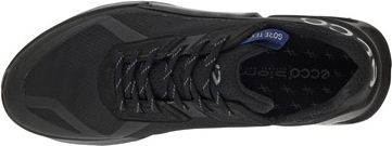 A black athletic shoe with laces.