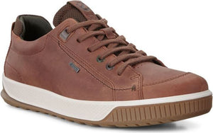 Low-cut brown leather sneaker with white rubber sole and brown rubber outsole.