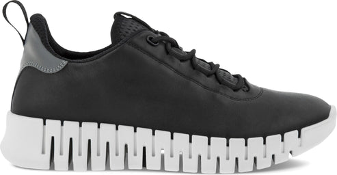 A black sneaker with a white sole and pull tab.
