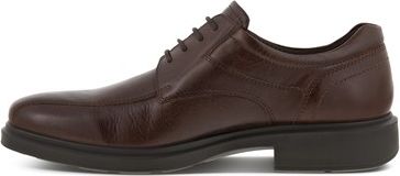 A brown leather dress shoe with black sole.
