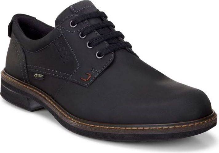 A low-cut, black, lace-up dress shoe with a rounded toe, eyelets, and contrasting sole stitching.