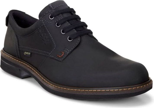 A low-cut, black, lace-up dress shoe with a rounded toe, eyelets, and contrasting sole stitching.