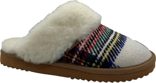 Slip-on slipper with cream wool lining and plaid pattern upper on a brown sole.