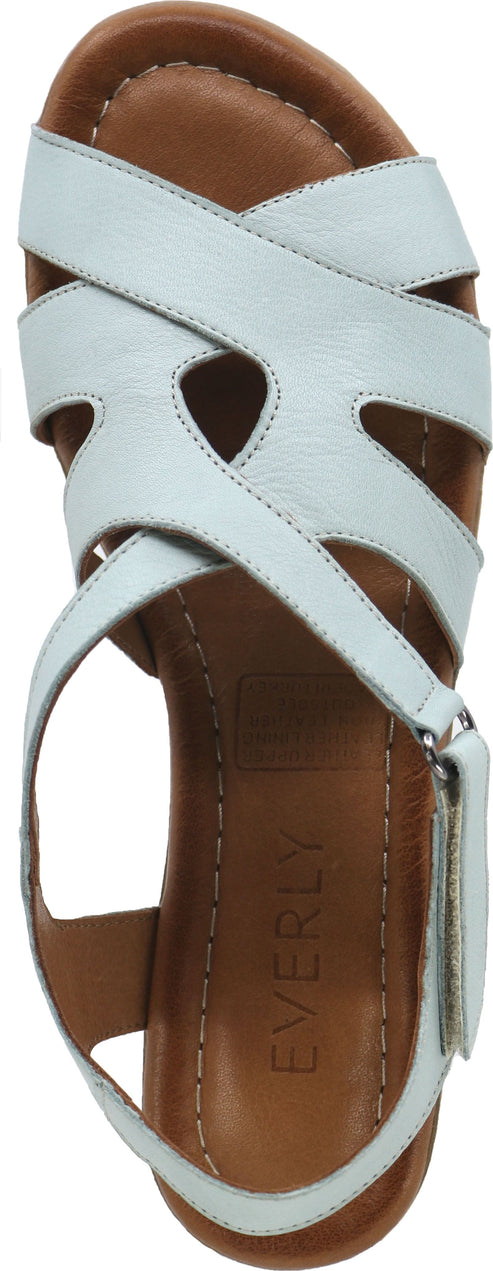 a pair of light blue strappy sandals