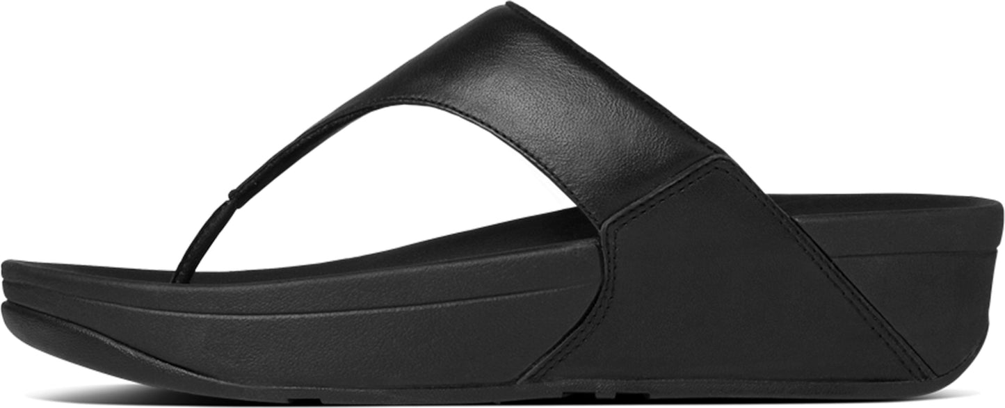 A black sandal with a thick sole.