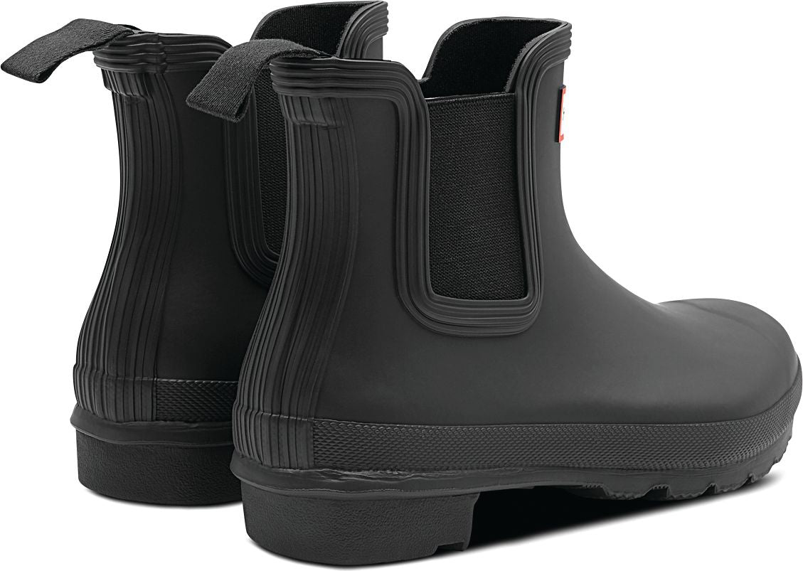 Pair of black rubber Chelsea rain boots, side elastic inserts, ridged heel and shaft.