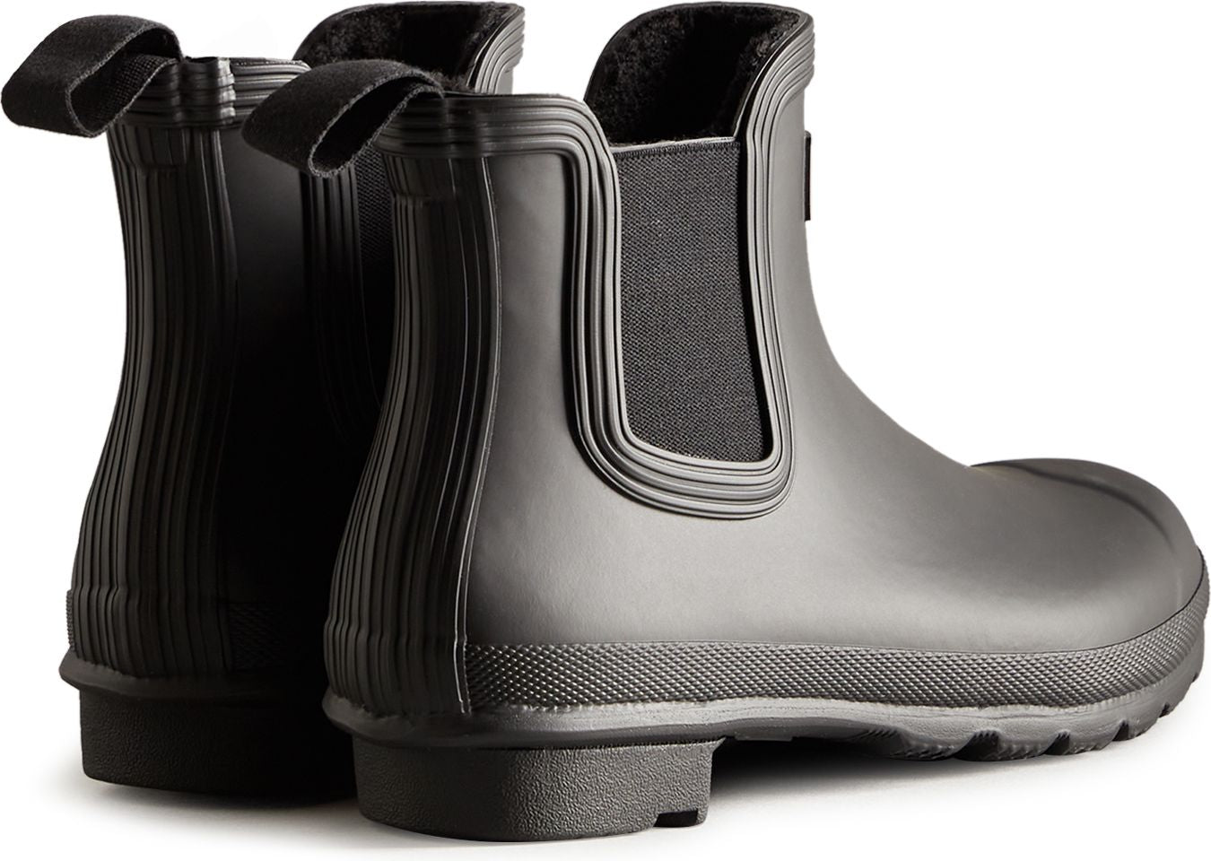 Pair of matte black, ankle-height Chelsea rain boots.