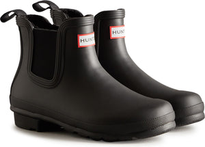 Pair of matte black rubber Chelsea rain boots with a red and white square logo on the side.