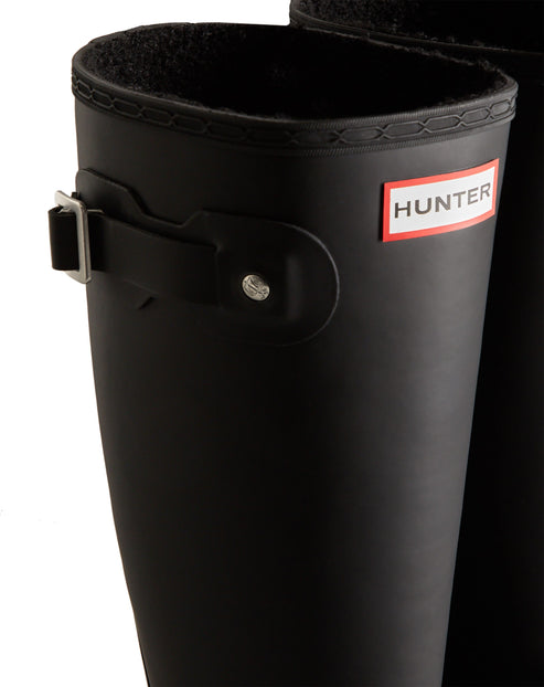 Black rain boots with side buckle and logo on red tag