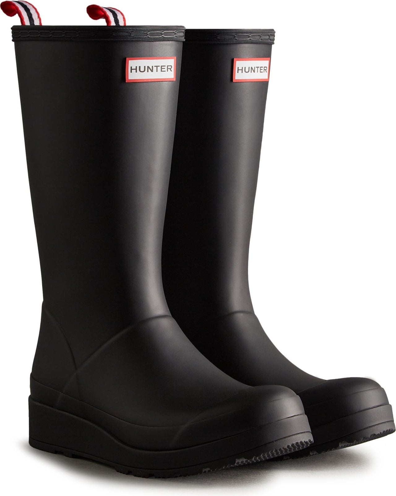 Pair of tall black rain boots with the word HUNTER near the top of each boot.