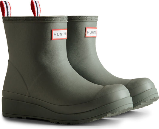 A pair of olive green short rain boots with a platform sole and pull tabs on the back.