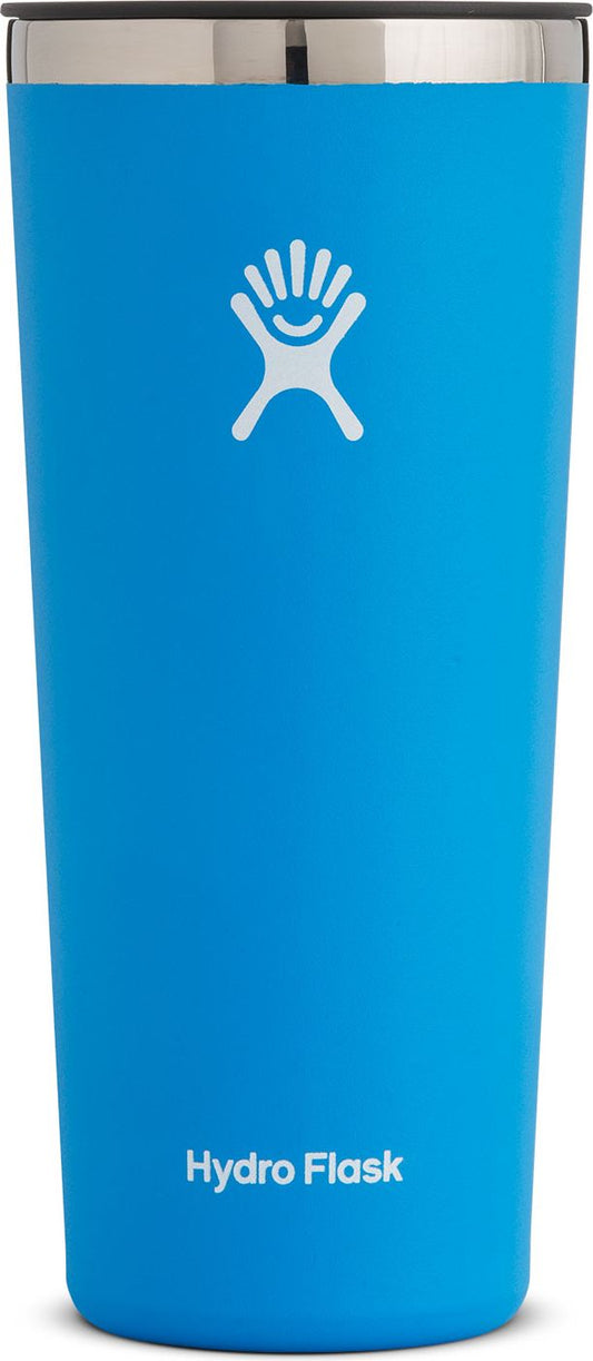A tall, blue tumbler with a silver rim and a white logo and text on the body.