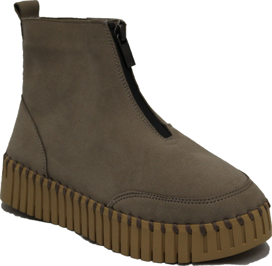 A taupe-colored, ankle-high boot with a prominent front zipper and a chunky, brown, ridged sole.
