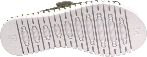 The sole of a shoe with a white, ribbed tread.