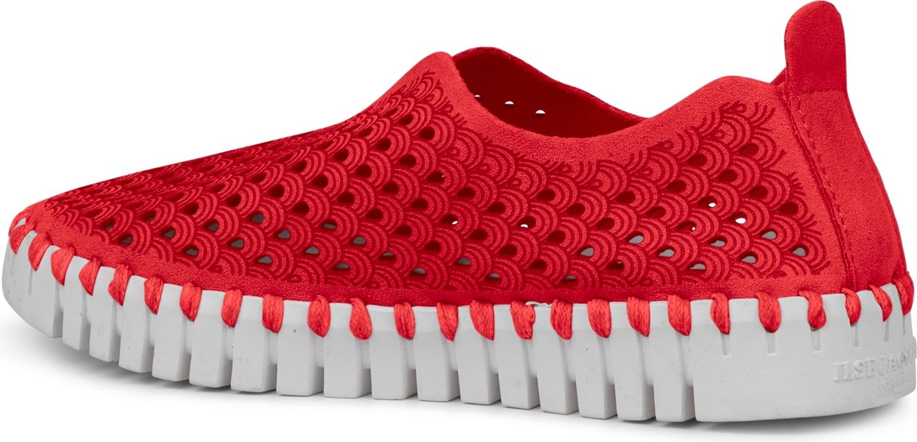 A red sneaker with a white sole.