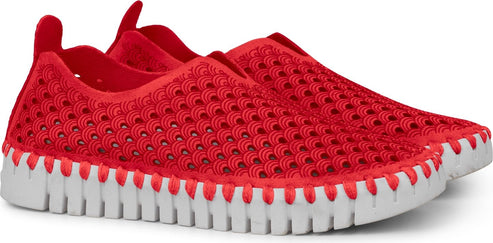 Pair of red perforated slip-on shoes with white soles.