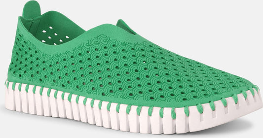 Slip-on shoe, green upper with decorative perforations, thick white sole.