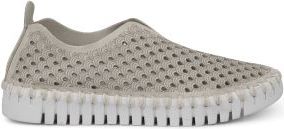 Beige slip-on shoe with hole pattern and white, segmented sole.