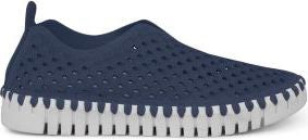 A navy blue perforated slip-on shoe with a white sole.