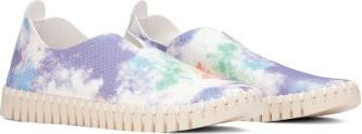 Two slip-on shoes with a tie-dye pattern in white, purple, green, and blue hues and a neutral sole.