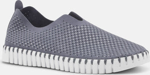 Perforated gray slip-on shoe with a white sole.
