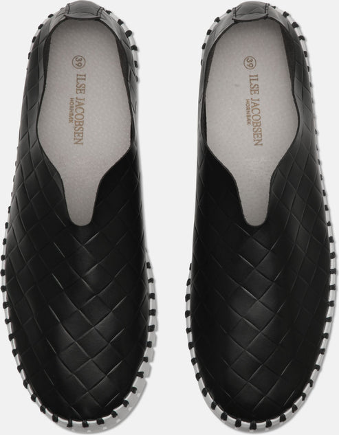 A pair of black slip-on shoes with a woven pattern and white trim.