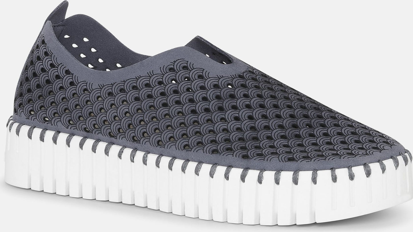 Gray slip-on shoe with a perforated design and thick white sole.