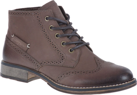 Brown leather wingtip boot with decorative perforations and dark laces.