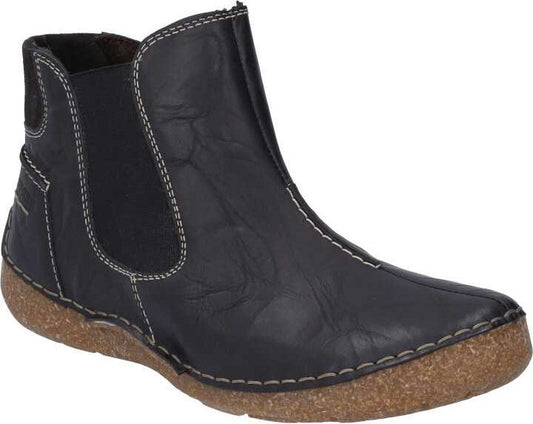 Black ankle boot with elastic side panel and stitched trim.