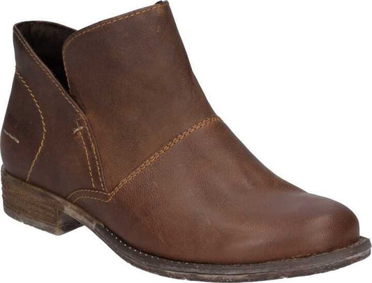 Brown leather ankle boot with no laces and low heel.