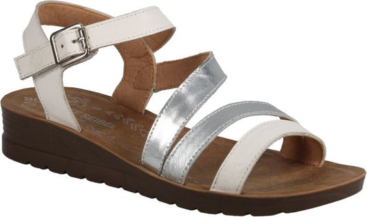 A sandal with white and silver straps, buckle closure, and a brown wedge sole.
