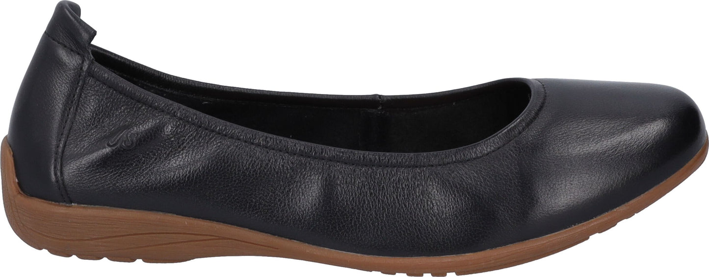 A black ballet flat shoe with a brown sole.