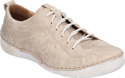 Beige leather low-top sneaker with white laces and white sole.