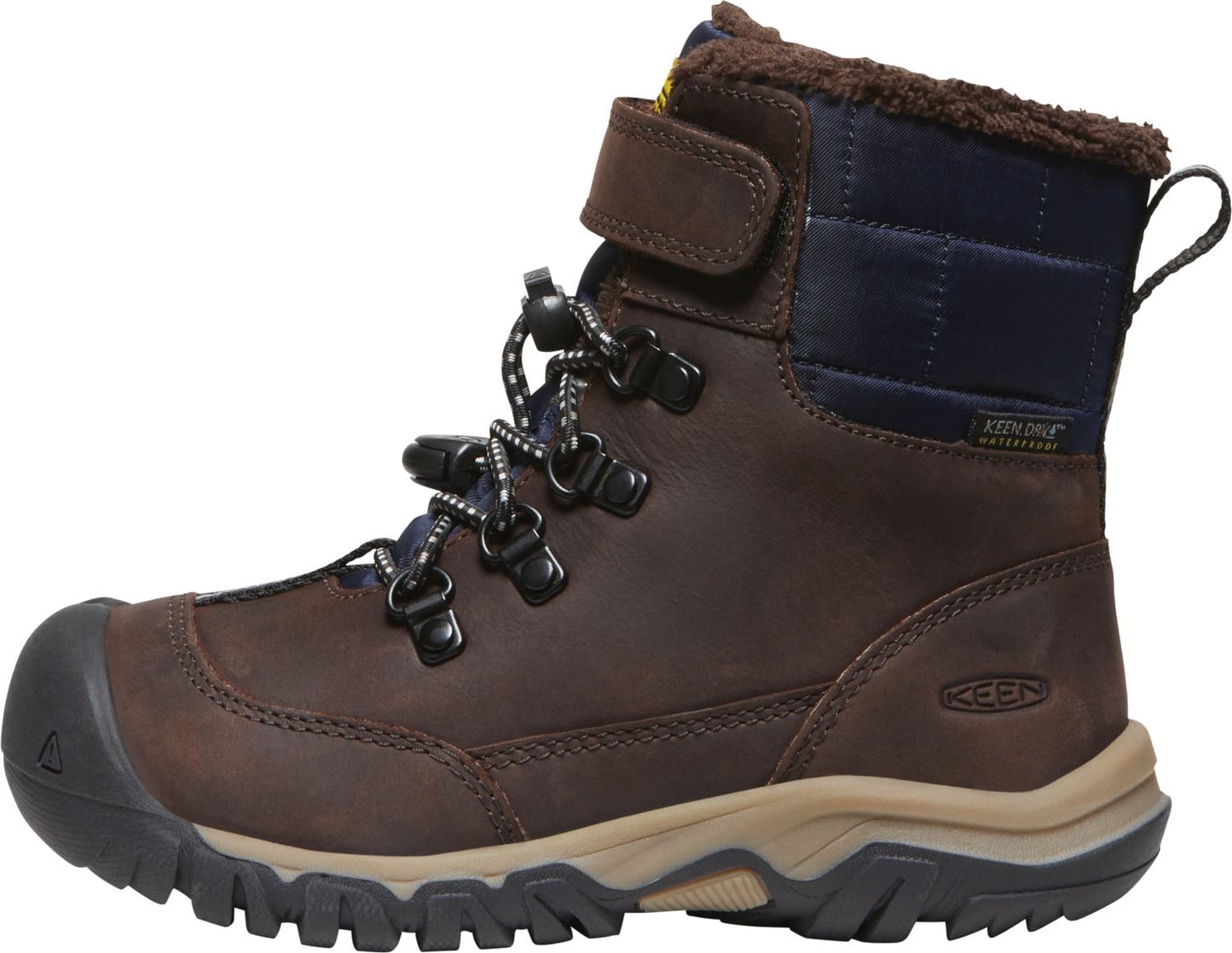 Dark brown leather boot with black toe bumper and black and white laces, velcro strap closure and faux fur trim around the top.