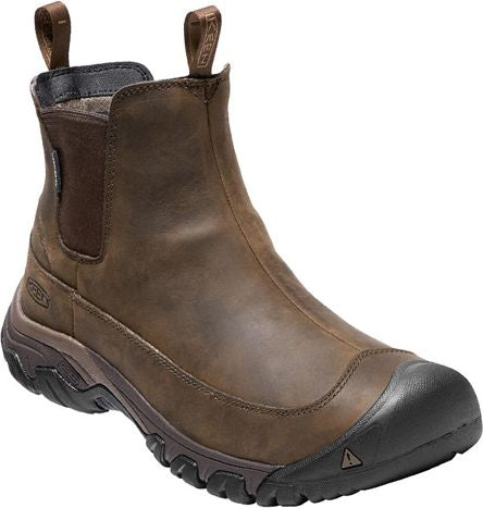 Brown, leather Chelsea boot with black sole and toe cap.