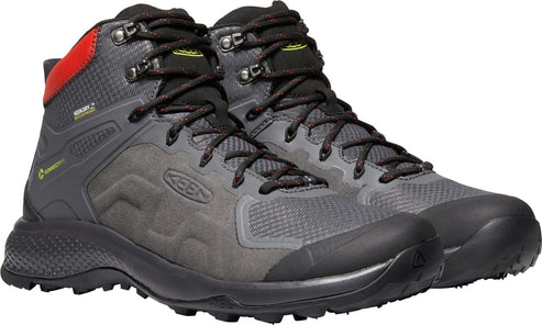 A pair of gray waterproof hiking boots with black soles and red detail on the back heel.