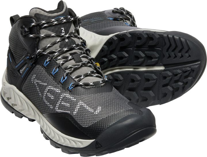 High top hiking shoe with black toe cap, grey and black uppers, patterned laces, the word "KEEN" on the side and white and black lugged sole.