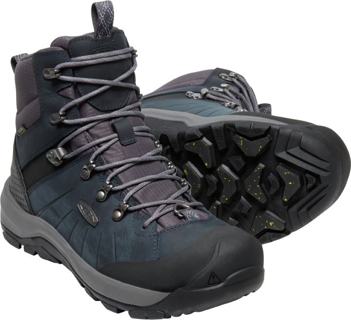Pair of high-top waterproof snow boots, featuring a lace-up closure, grey laces, metal eyelets, dark blue and grey upper, and a black lug sole with yellow accents.