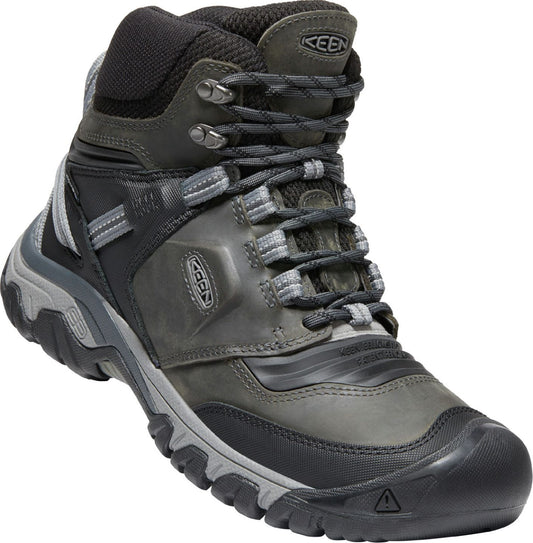 High-top hiking boot with a gray and black color scheme, lace-up closure, and sturdy treaded sole.