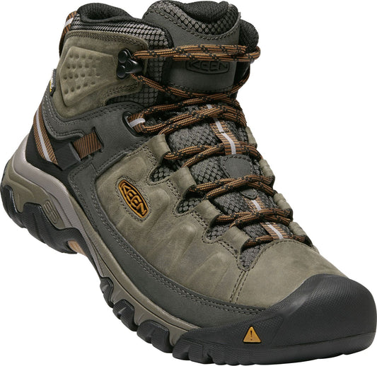 High-top hiking boot with a gray leather upper, brown laces, a reinforced black toe cap, and a logo patch on the side.