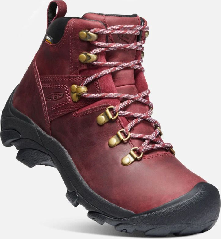 A maroon leather hiking boot with pink and white laces and a black sole.