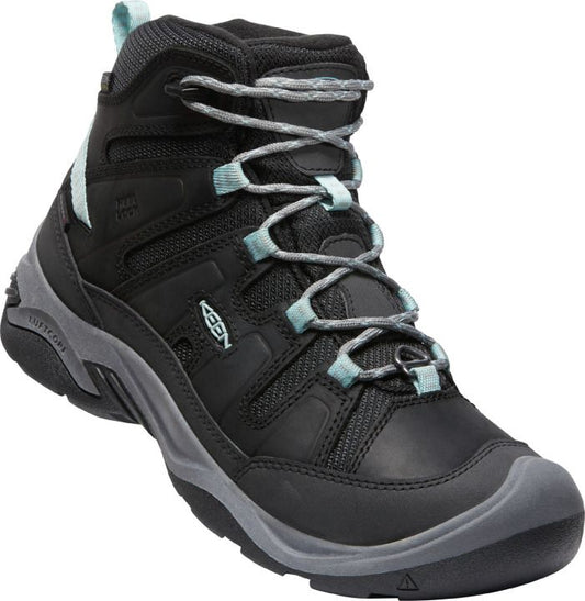 Black hiking boot with gray sole and light blue trim.