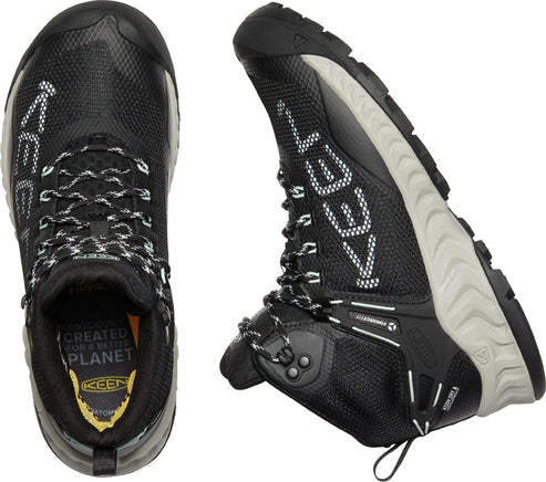 Two-angled view of a black hiking boot with a white sole and laces. The word "KEEN" is vertically displayed in white letters on the side of the boot.