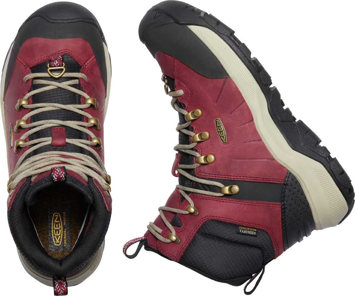 Pair of red and black hiking boots with tan laces and metal eyelets.